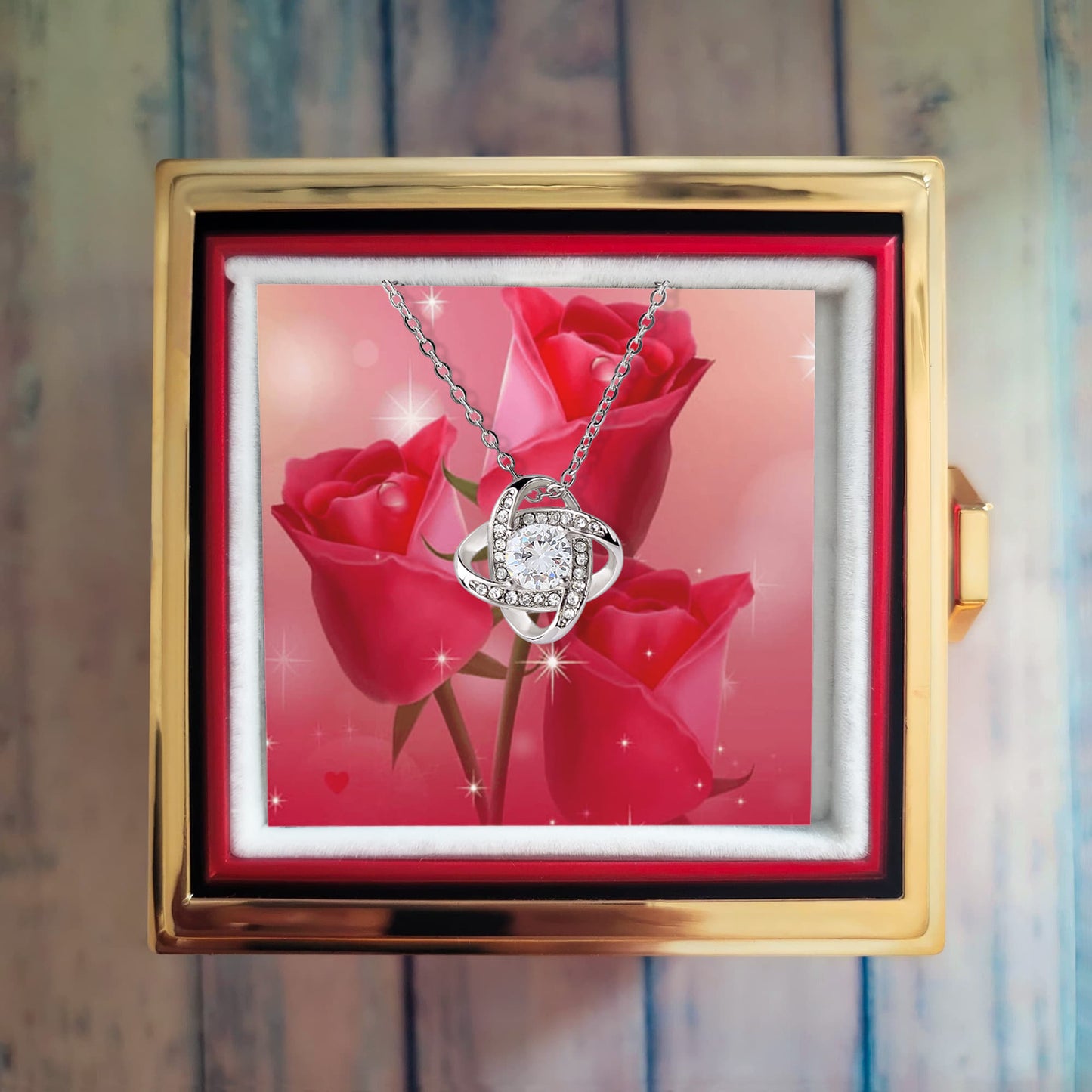 Liebesknoten mit rotierender Rosengeschenkbox