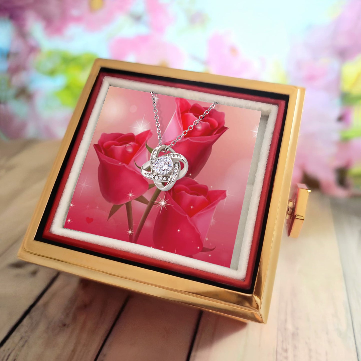 Liebesknoten mit rotierender Rosengeschenkbox
