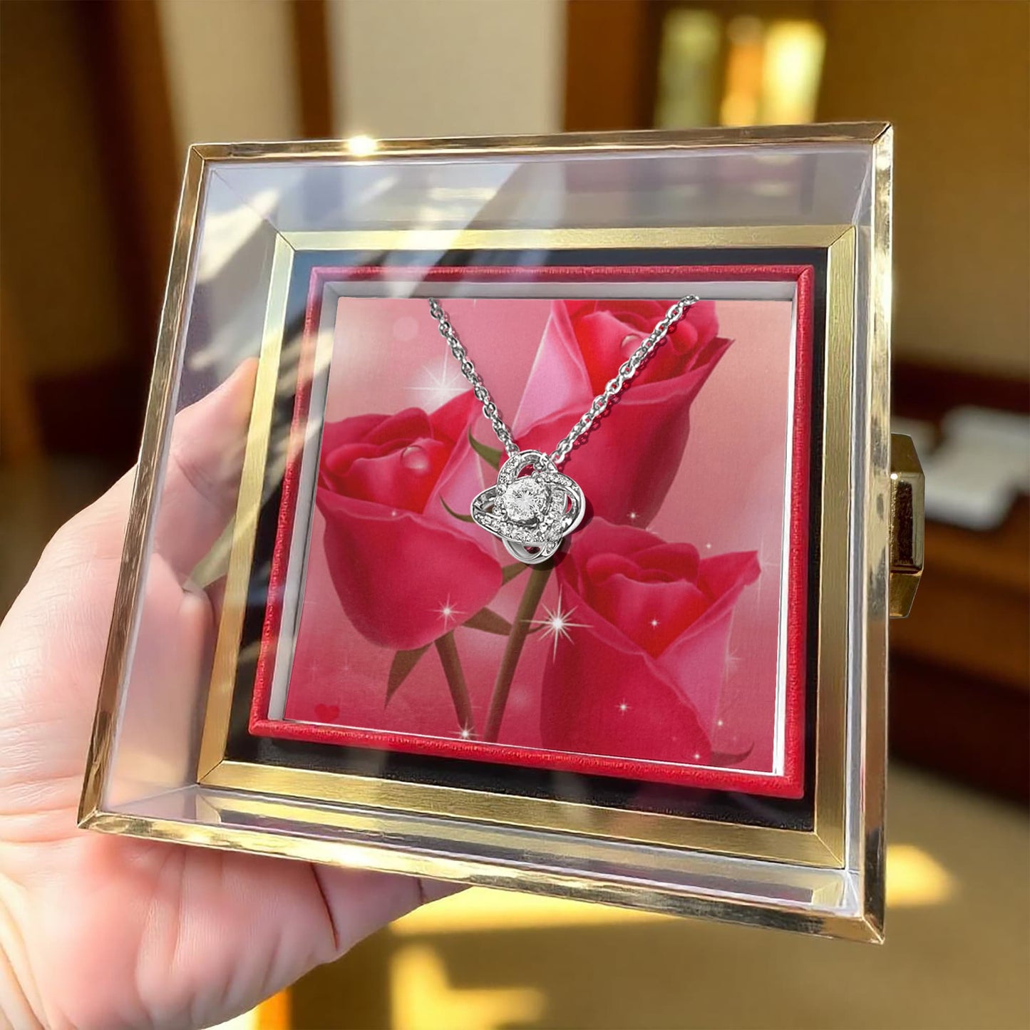 Liebesknoten mit rotierender Rosengeschenkbox